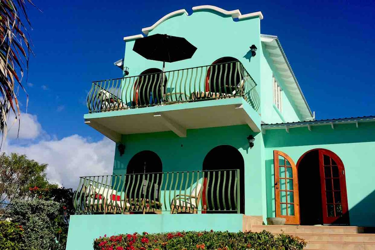 The turquoise arched exterior of Sea Mist in Atlantic Shores